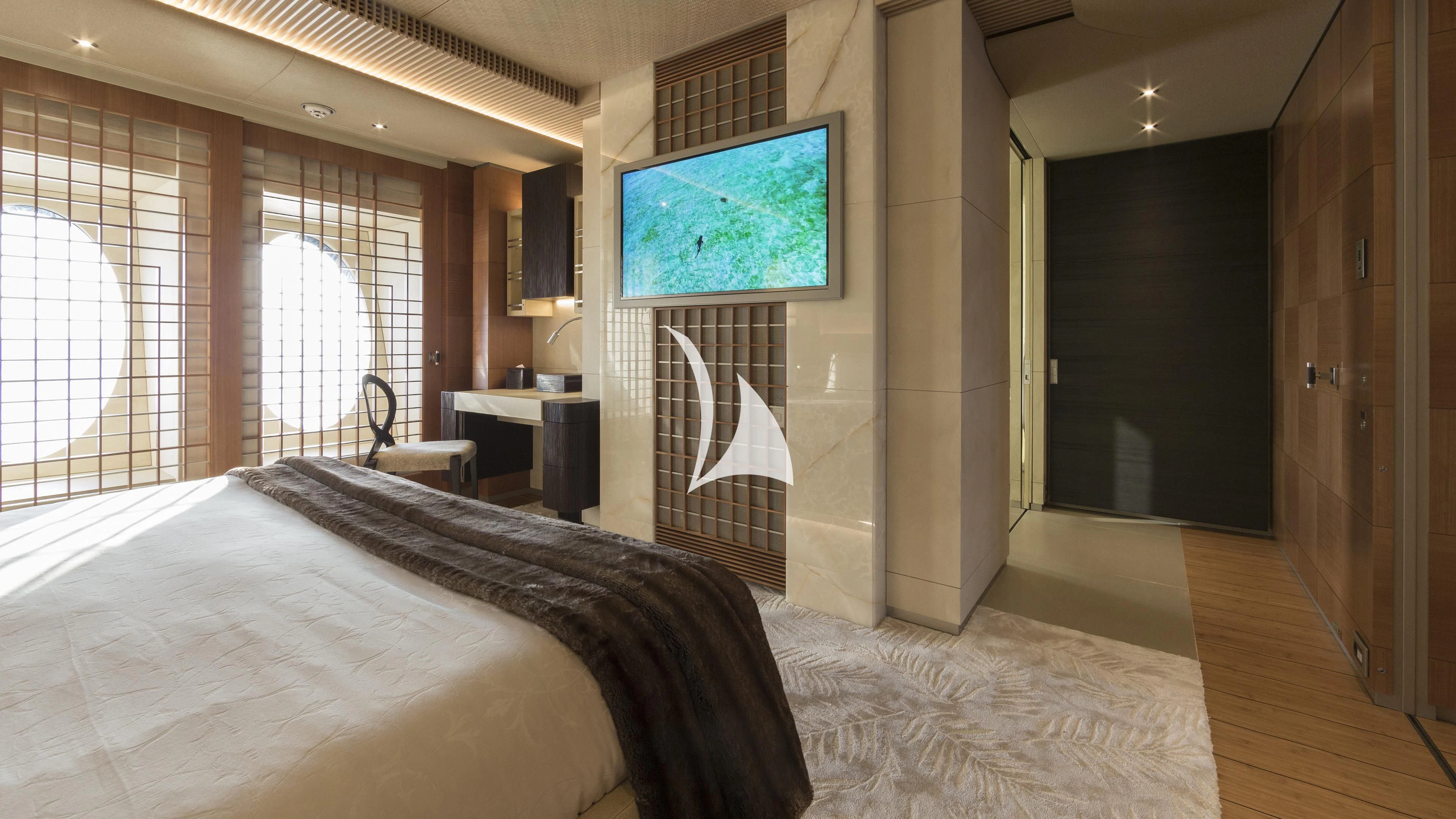 a bedroom with a large bed aboard NIRVANA Yacht for Sale