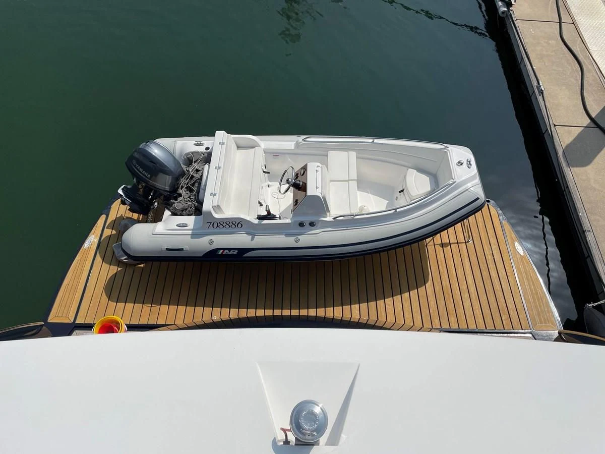 a small white car with a black hood aboard SUNSEEKER 30M Yacht for Sale