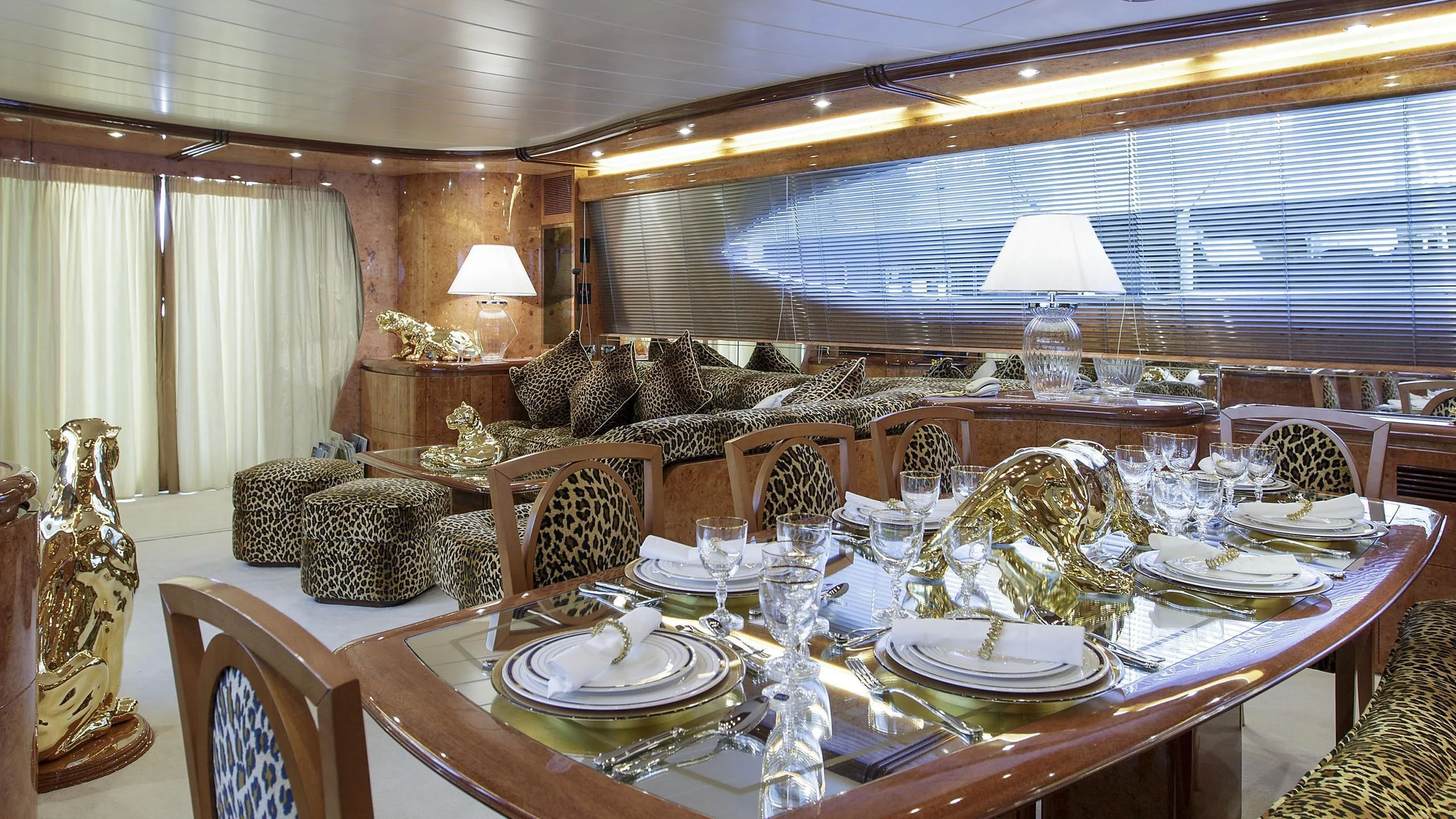 a dining room with a large window aboard SEA JAGUAR Yacht for Sale