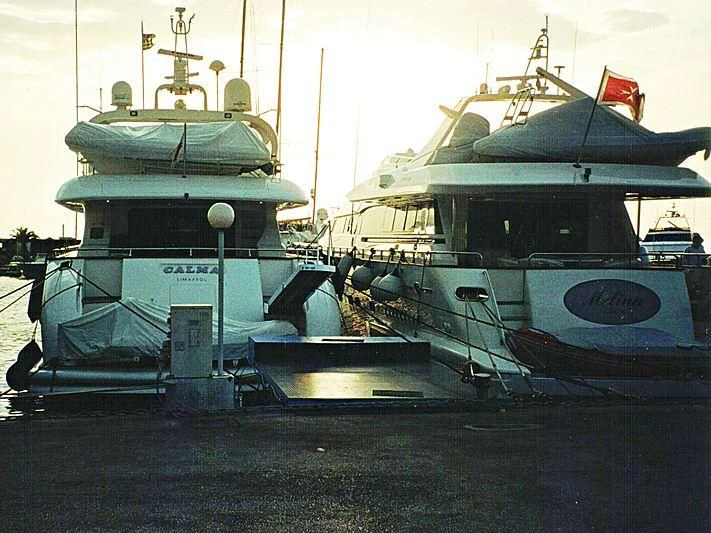 a group of boats sit in a harbor aboard SEA JAGUAR Yacht for Sale