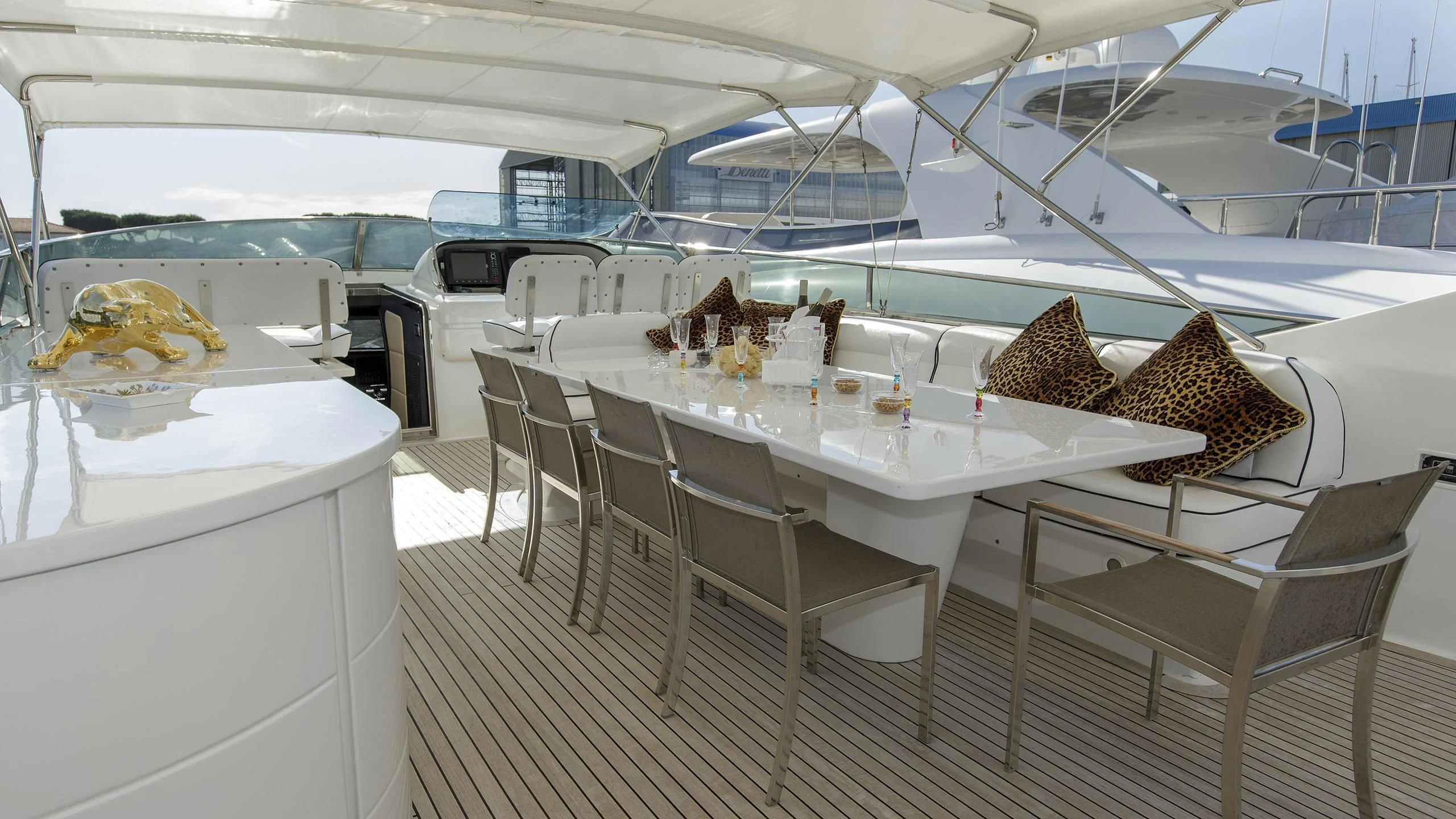 a table with chairs around it aboard SEA JAGUAR Yacht for Sale
