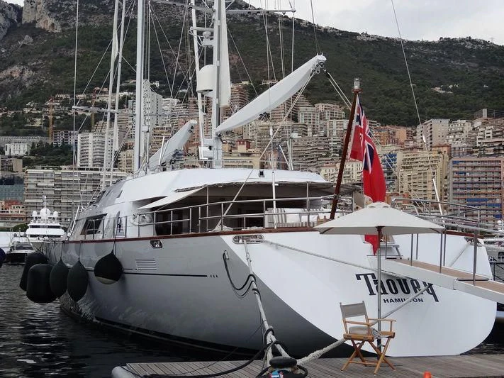 a boat with a flag on it aboard TAOUEY Yacht for Sale