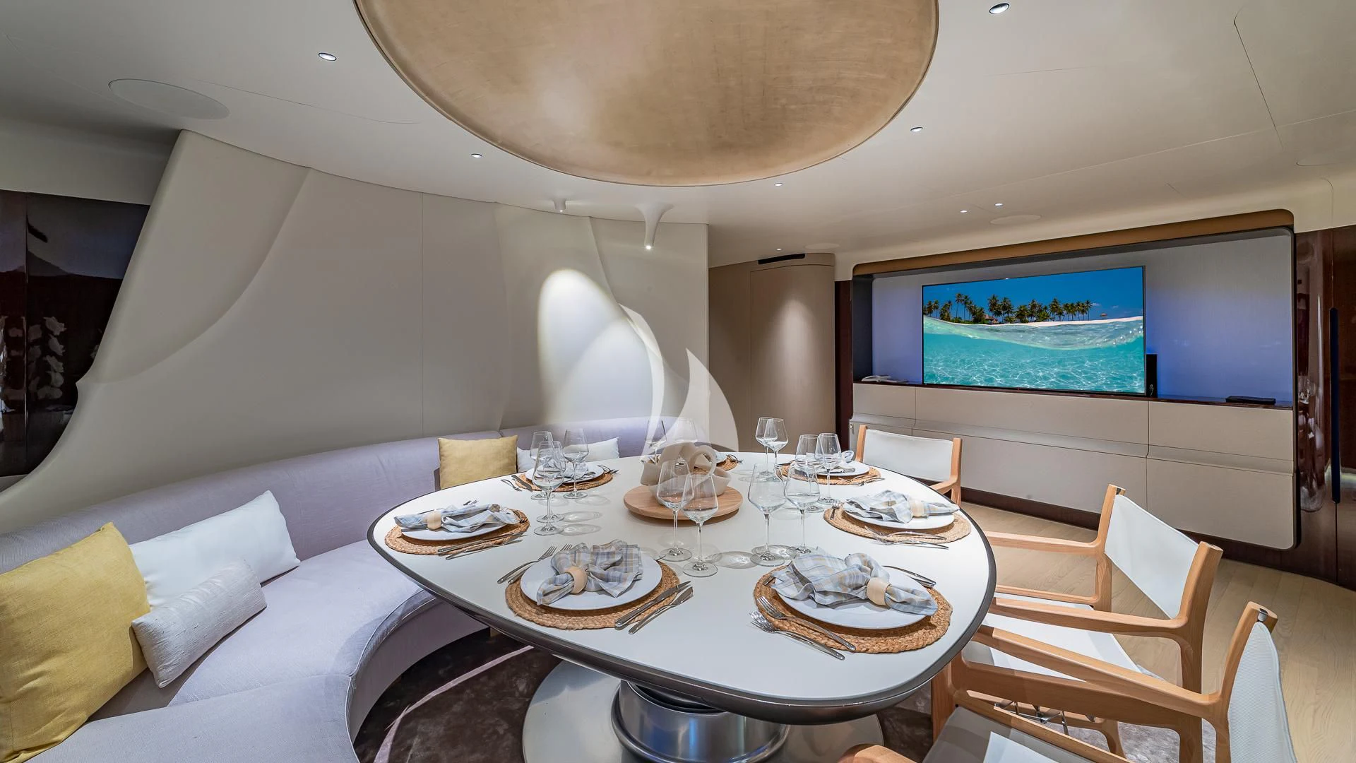 a large room with a table and chairs aboard VOLO MARE Yacht for Charter