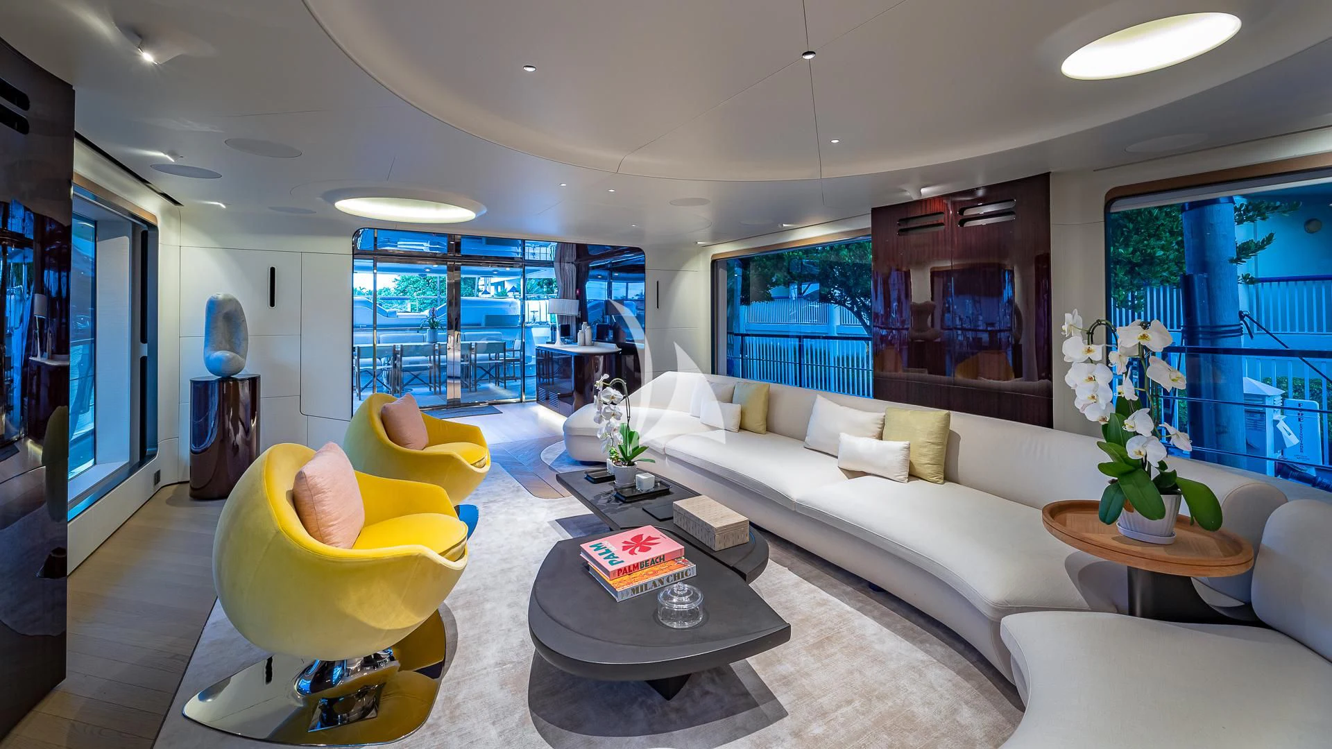 a living room with a large window aboard VOLO MARE Yacht for Charter