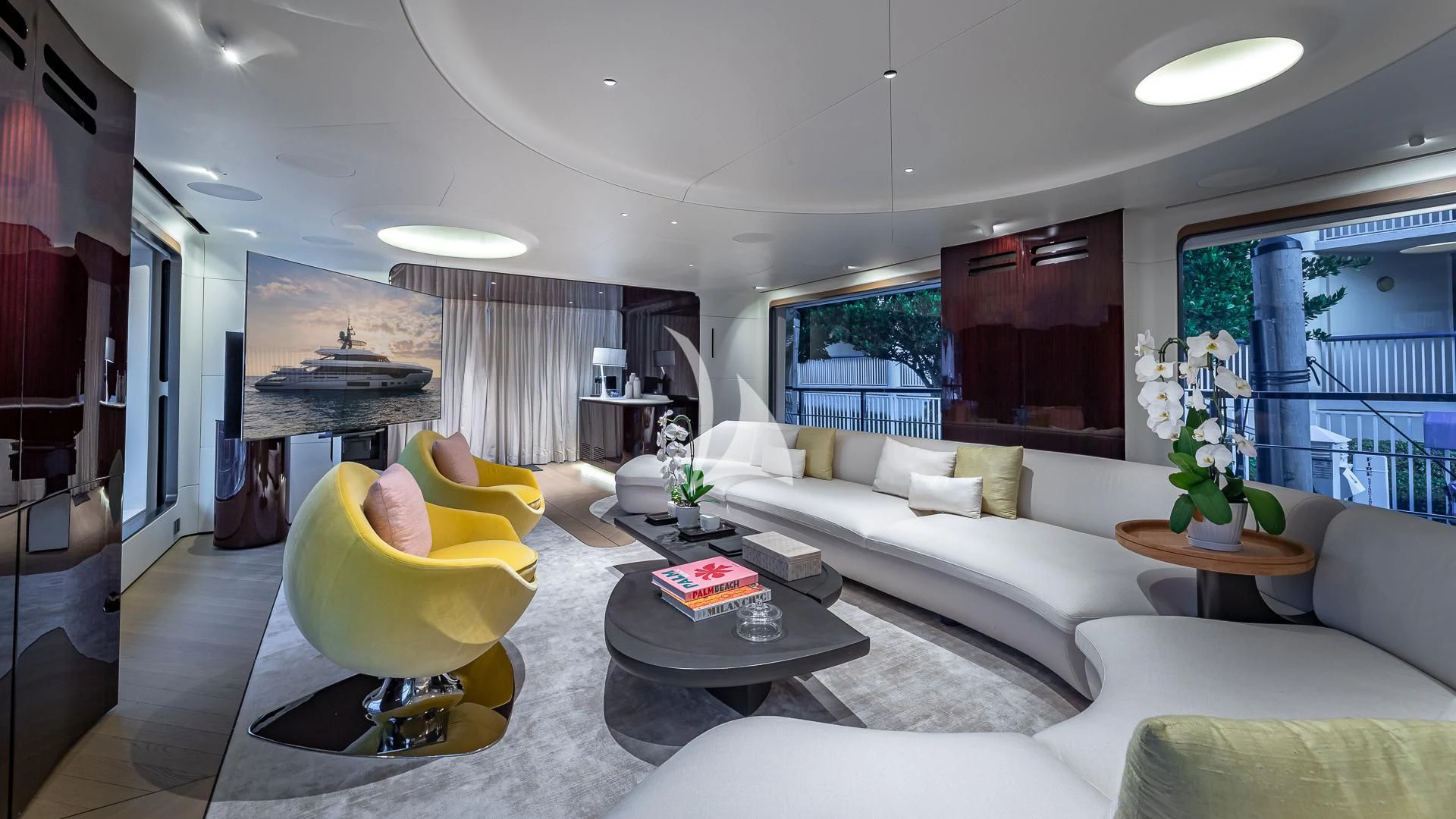 a living room with a couch and a table aboard VOLO MARE Yacht for Charter