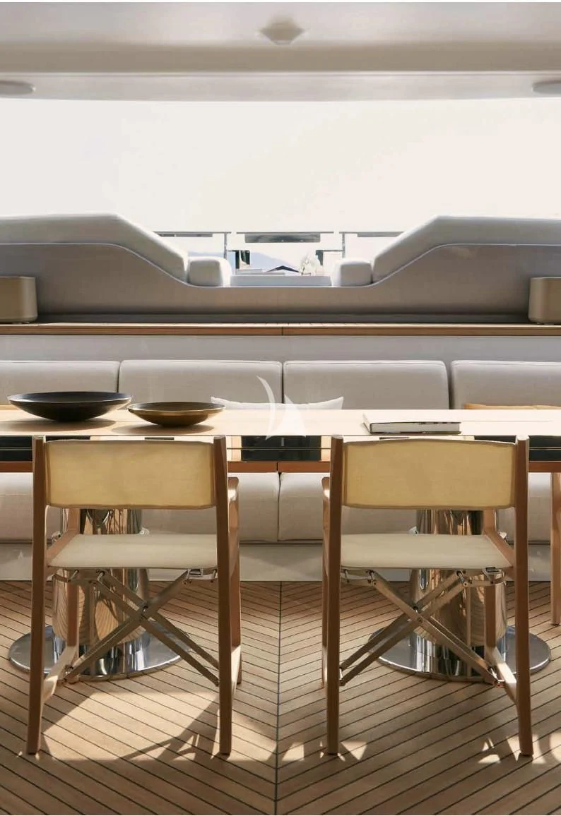 a table with chairs and a plate on it aboard VOLO MARE Yacht for Charter