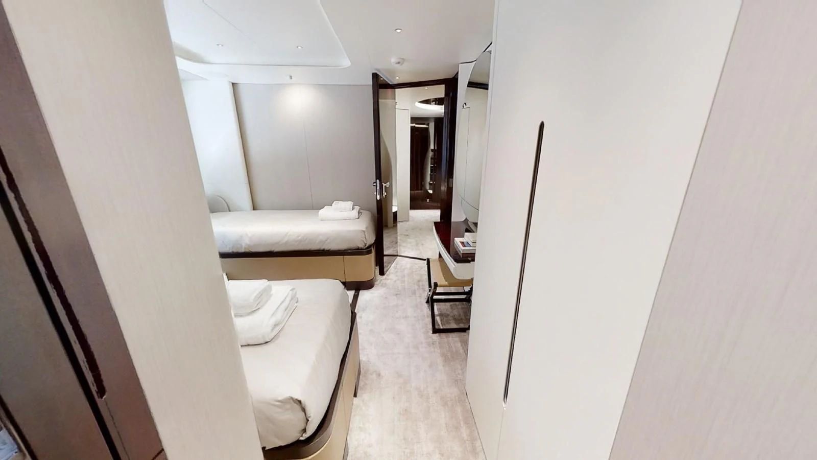 a room with a bed and a mirror aboard VOLO MARE Yacht for Charter
