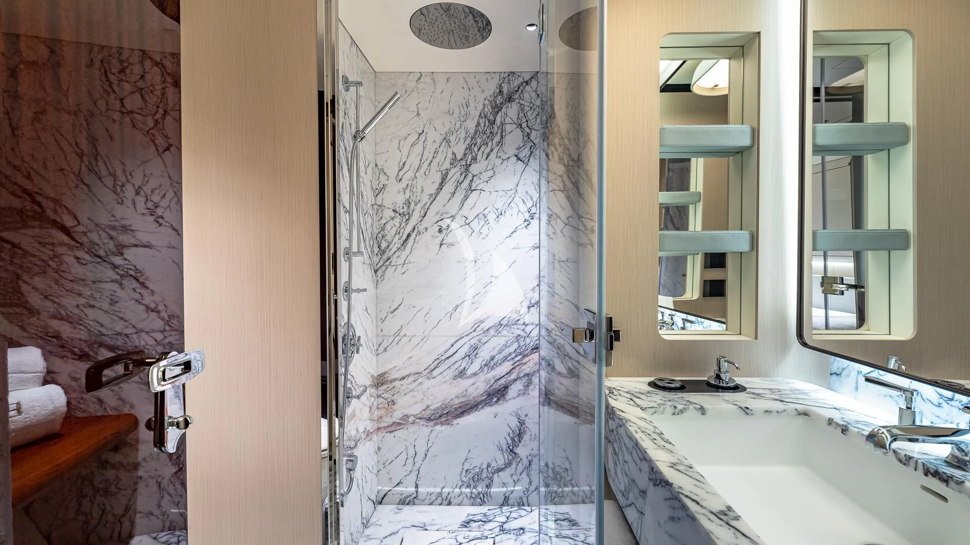 a bathroom with a glass shower aboard VOLO MARE Yacht for Charter
