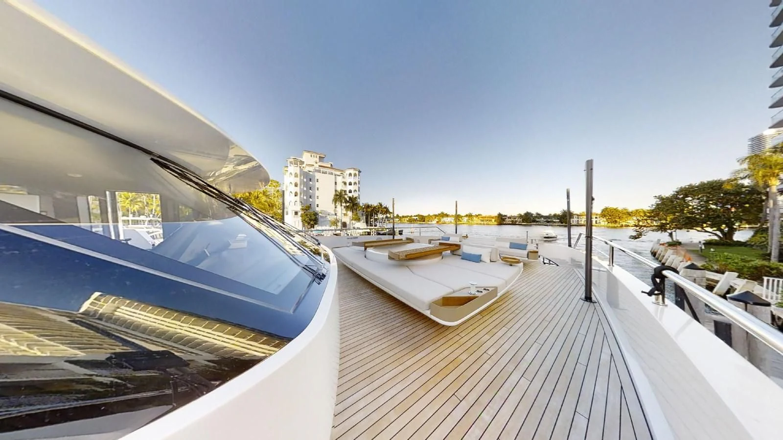a deck with a pool and a city in the background aboard VOLO MARE Yacht for Charter
