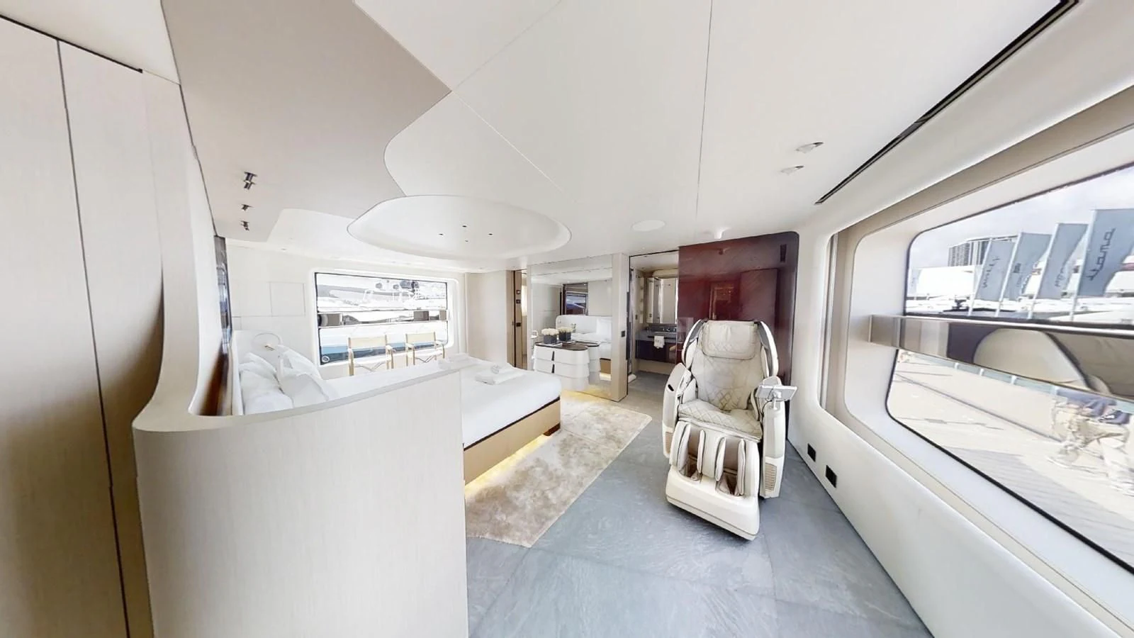 a room with a chair and a bed aboard VOLO MARE Yacht for Charter