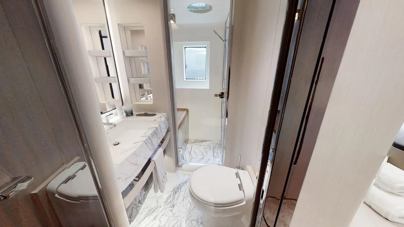 a bathroom with a toilet and a sink aboard VOLO MARE Yacht for Charter