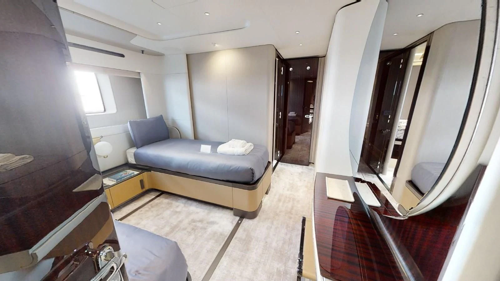 a living room with a couch and a television aboard VOLO MARE Yacht for Charter