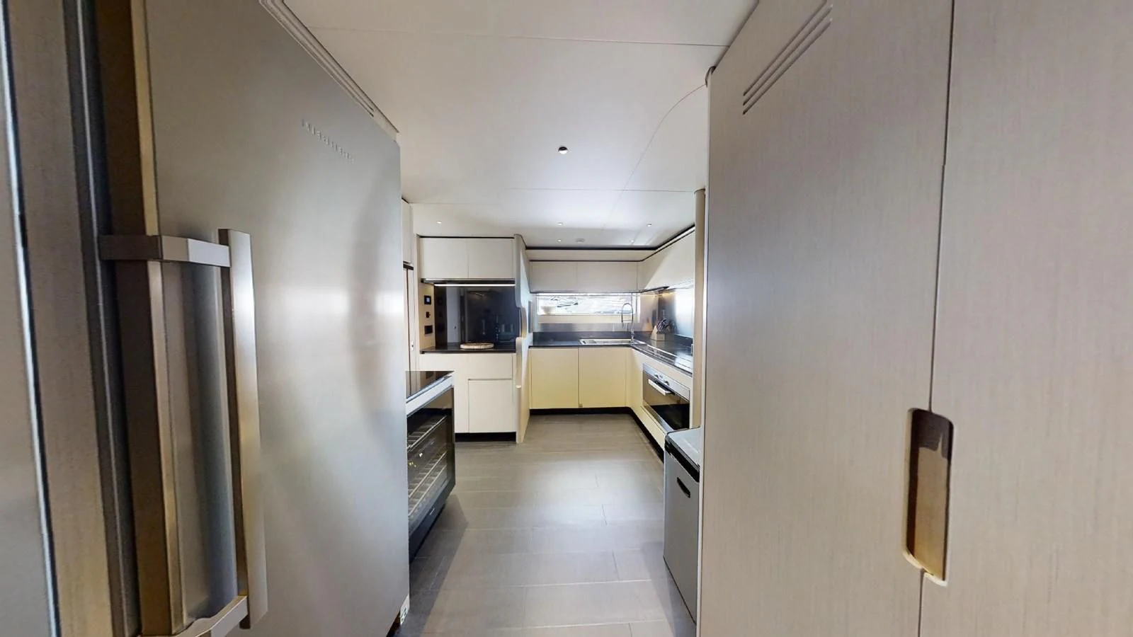 a hallway with a door and cabinets aboard VOLO MARE Yacht for Charter