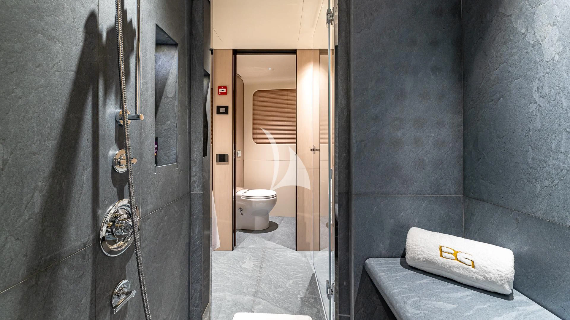 a bathroom with a toilet and a sink aboard VOLO MARE Yacht for Charter