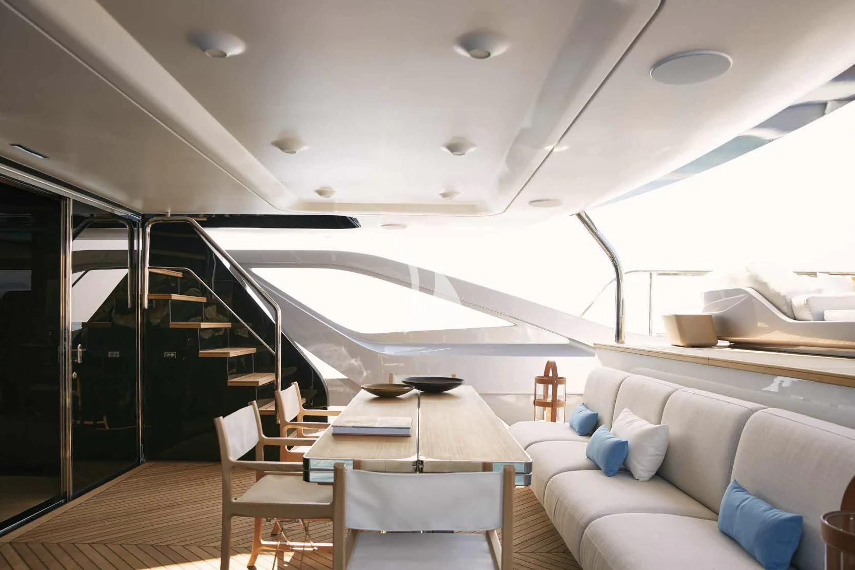 a room with a table and couch aboard VOLO MARE Yacht for Charter