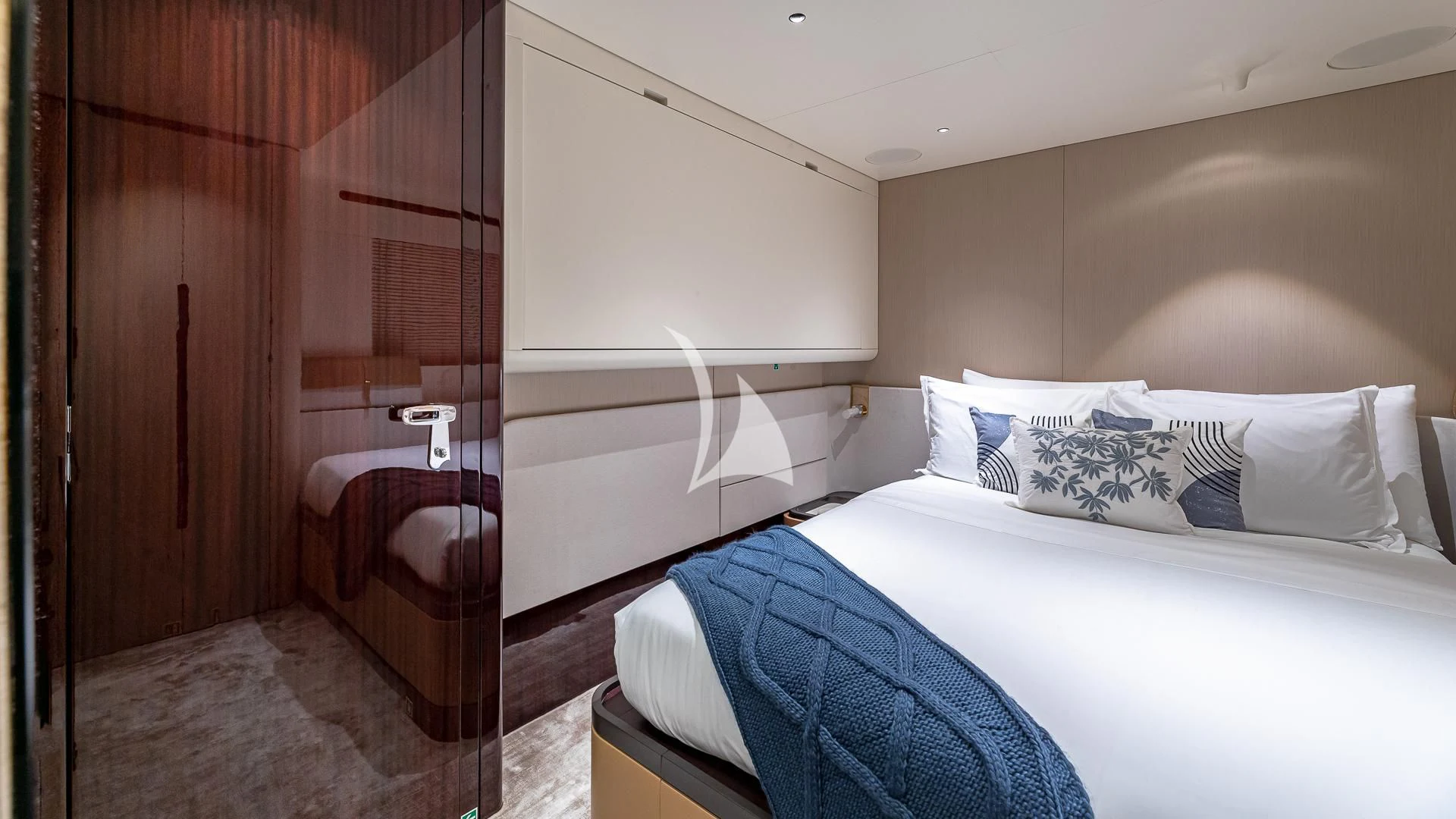 a bed with a white bed aboard VOLO MARE Yacht for Charter