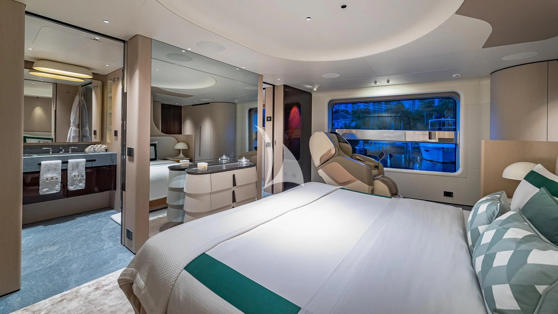 a bedroom with a bed and a couch aboard VOLO MARE Yacht for Charter