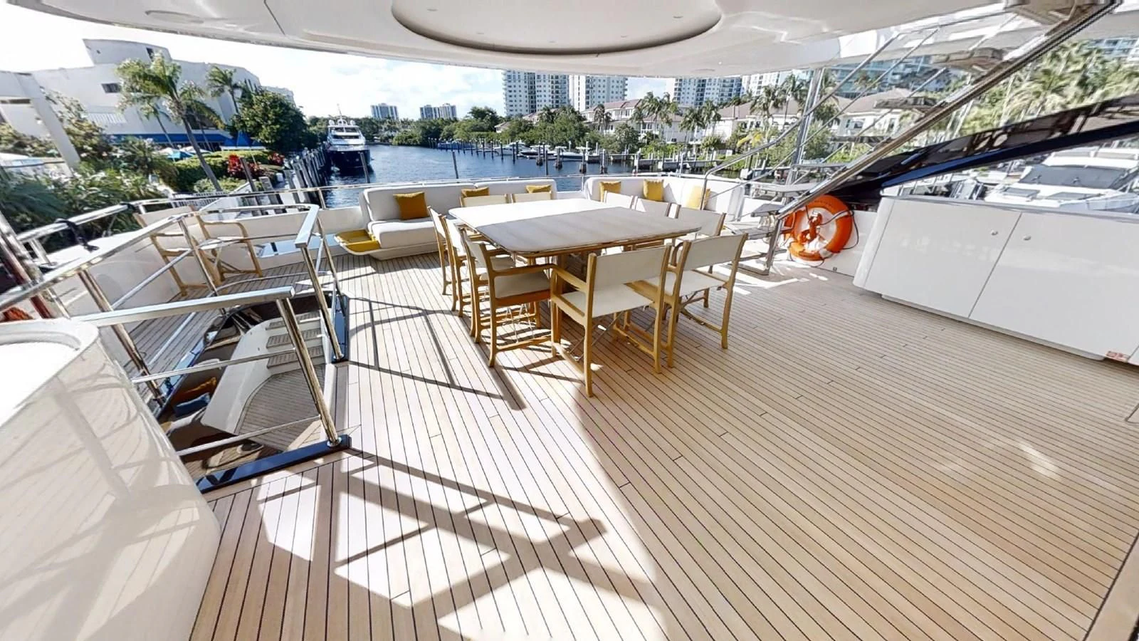 a deck with tables and chairs aboard VOLO MARE Yacht for Charter