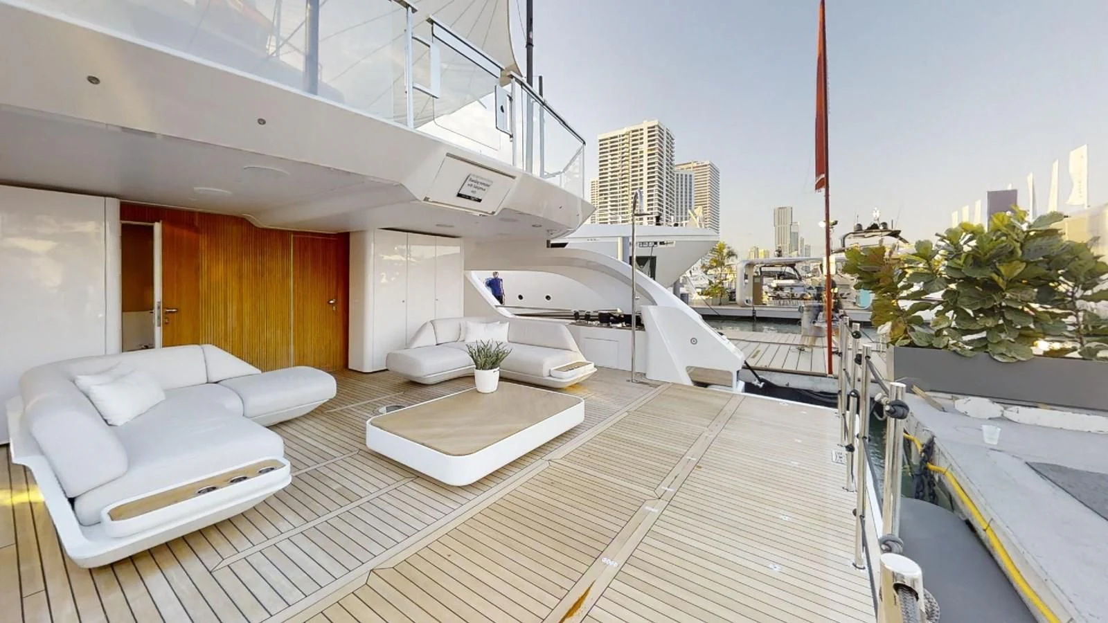 a large white boat in a large room with a city skyline aboard VOLO MARE Yacht for Charter