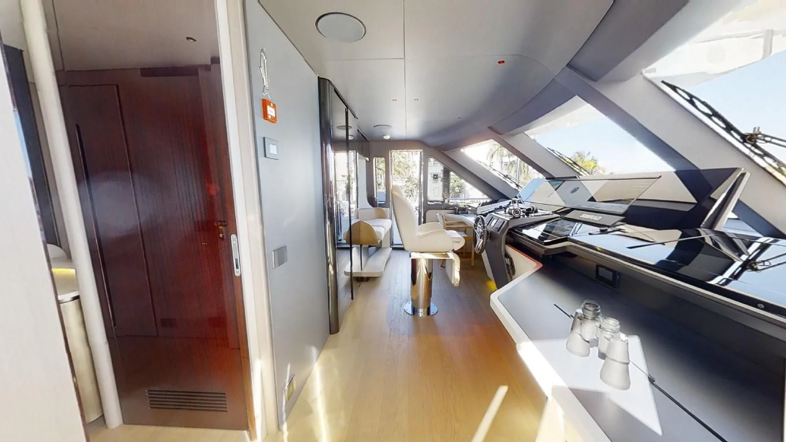 a room with a desk and chairs aboard VOLO MARE Yacht for Charter