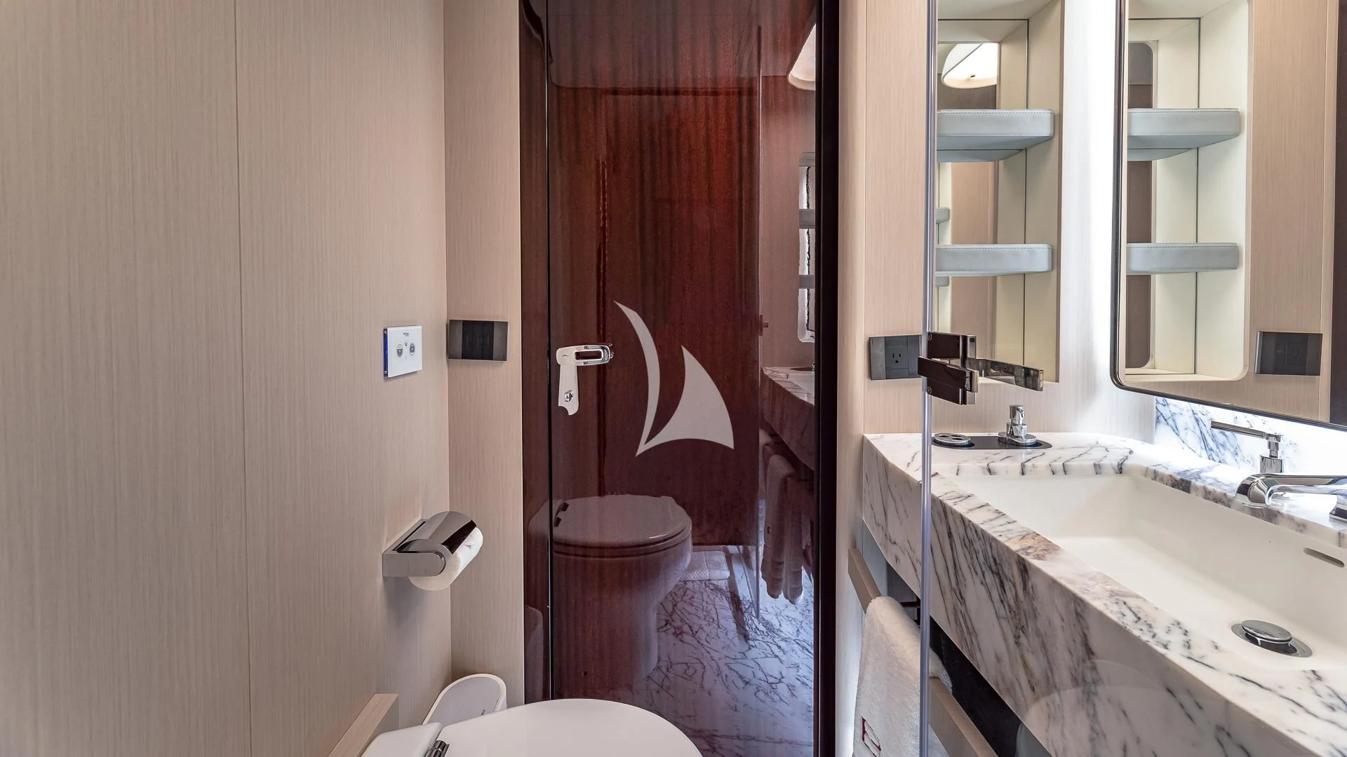 a bathroom with a sink and toilet aboard VOLO MARE Yacht for Charter