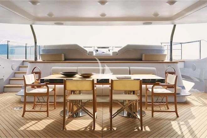 a room with a table and chairs aboard VOLO MARE Yacht for Charter