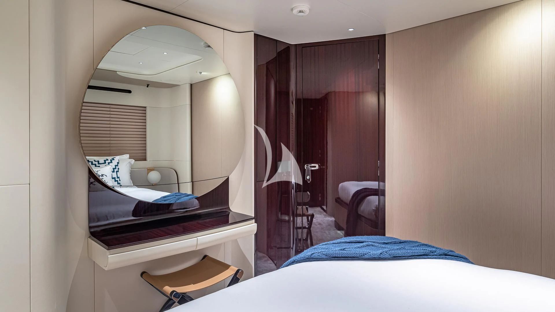 a bedroom with a mirror aboard VOLO MARE Yacht for Charter