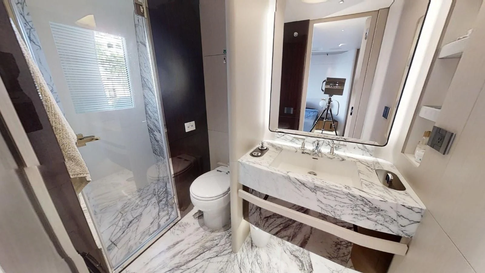 a bathroom with a tub sink and toilet aboard VOLO MARE Yacht for Charter