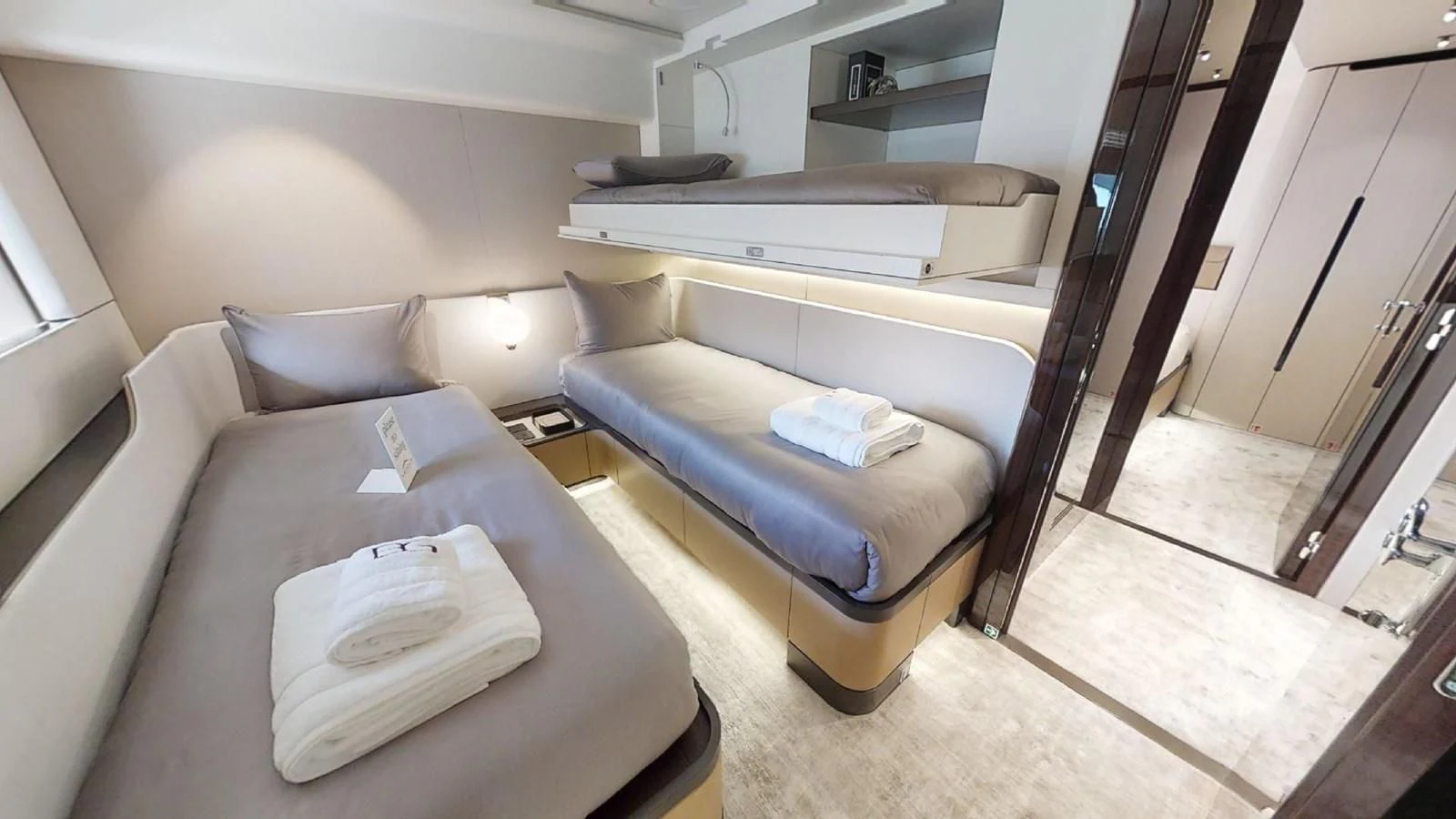 a room with a bed and a desk aboard VOLO MARE Yacht for Charter