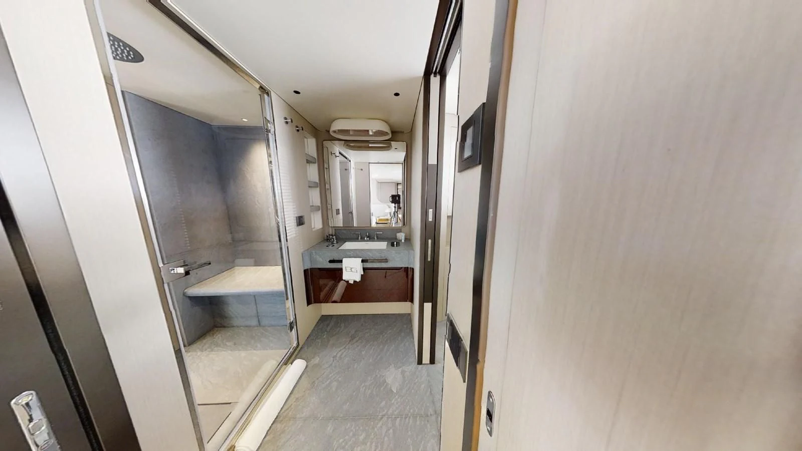 a hallway with a sink and a mirror aboard VOLO MARE Yacht for Charter