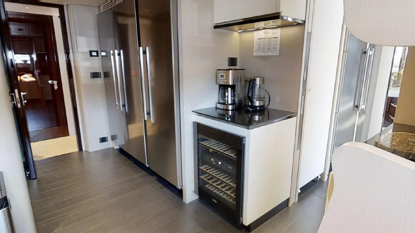 a kitchen with stainless steel appliances aboard VOLO MARE Yacht for Charter