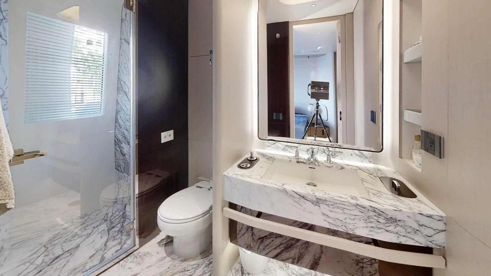a bathroom with a sink and a mirror aboard VOLO MARE Yacht for Charter