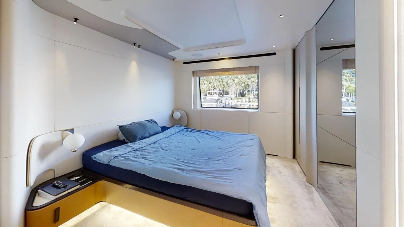 a bedroom with a bed and a desk aboard VOLO MARE Yacht for Charter