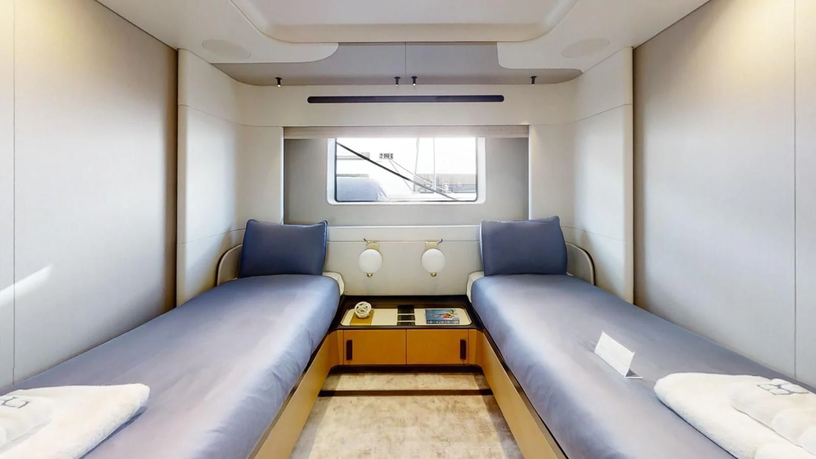 a room with a bed and a desk aboard VOLO MARE Yacht for Charter