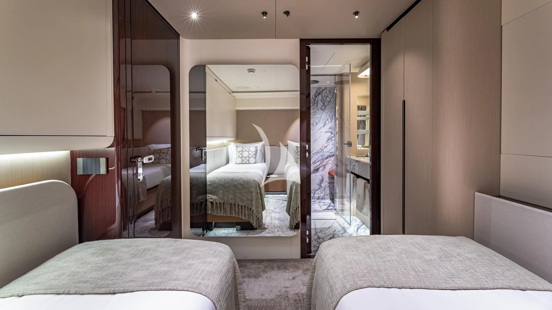 a room with a bed and a mirror aboard VOLO MARE Yacht for Charter