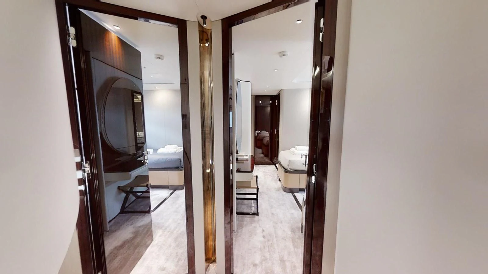 a hallway with a mirror and a bed aboard VOLO MARE Yacht for Charter