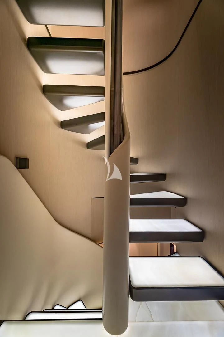 a white staircase with a black railing aboard VOLO MARE Yacht for Charter