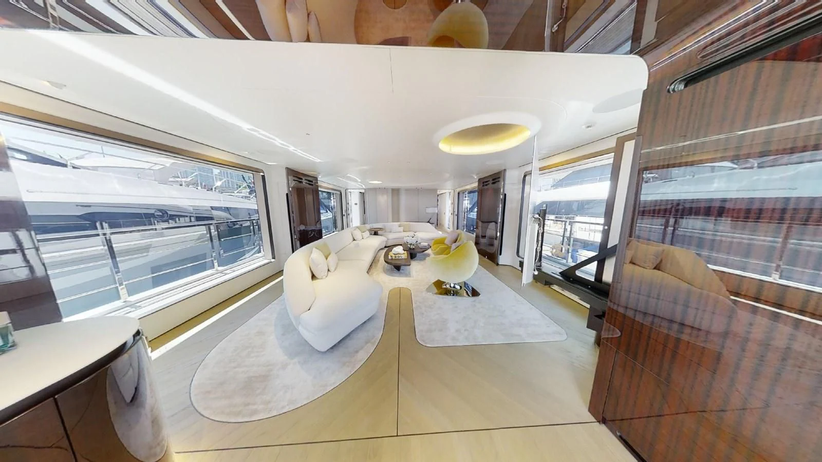 inside of a building with a large window and a table with chairs aboard VOLO MARE Yacht for Charter