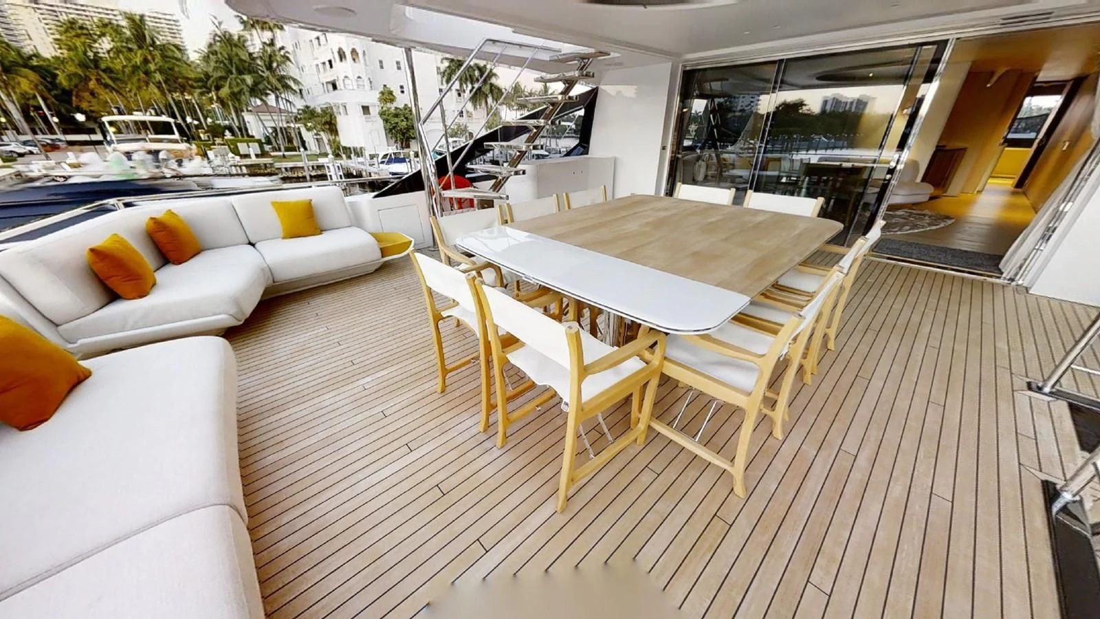 a deck with tables and chairs aboard VOLO MARE Yacht for Charter