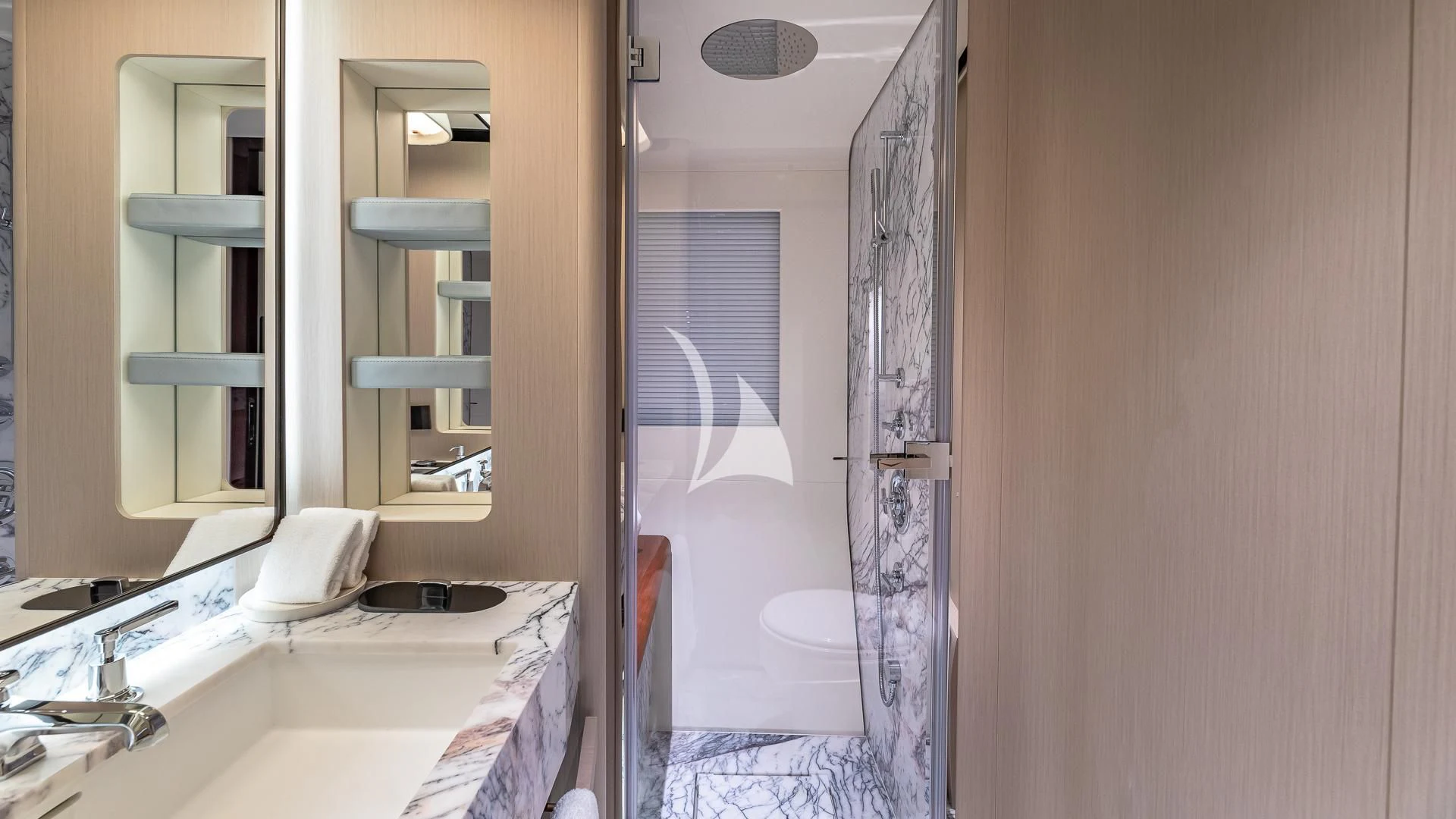a room with a bed and a mirror aboard VOLO MARE Yacht for Charter