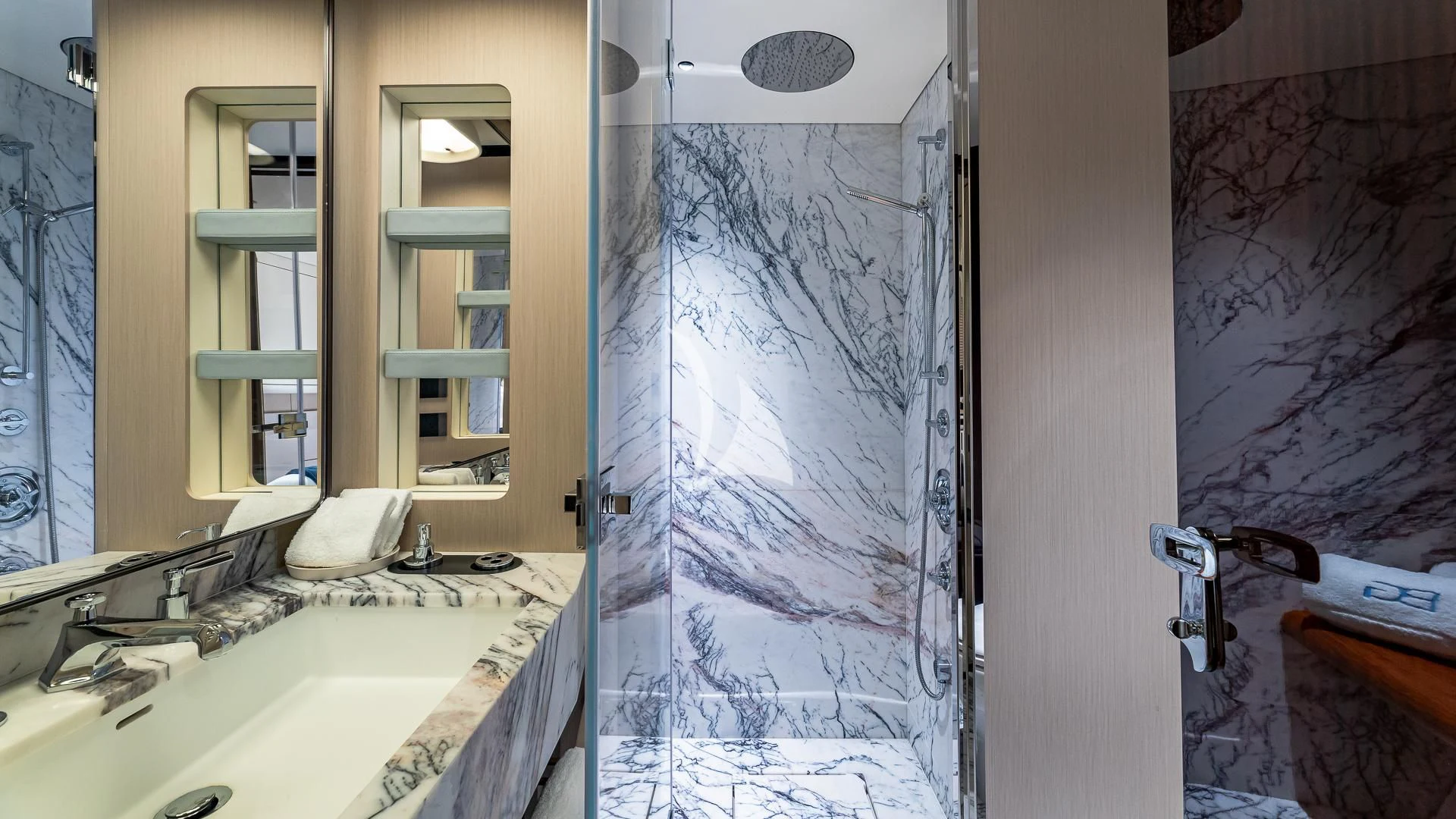 a bathroom with a shower and sink aboard VOLO MARE Yacht for Charter
