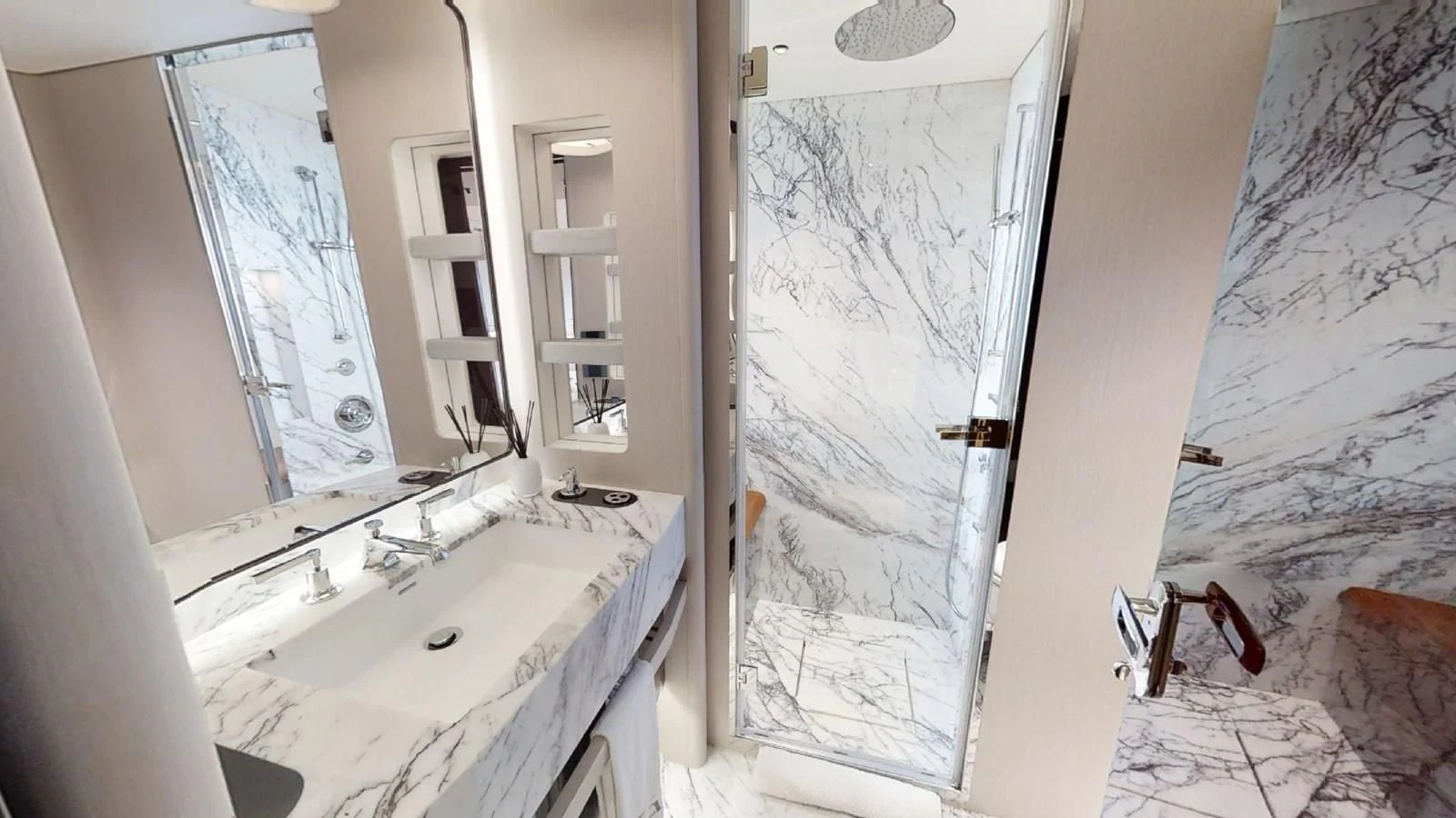 a bathroom with a sink and a large window aboard VOLO MARE Yacht for Charter