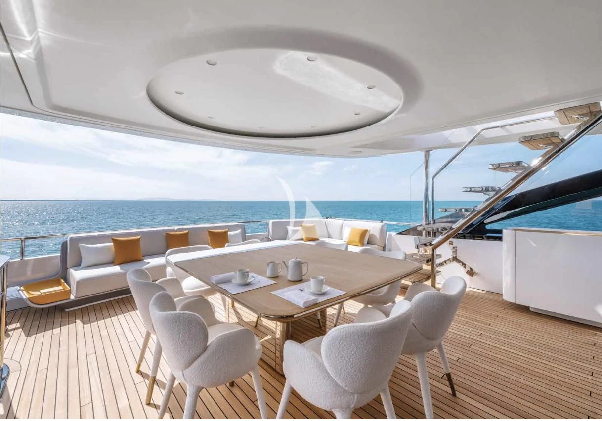 a room with a table and chairs aboard VOLO MARE Yacht for Charter
