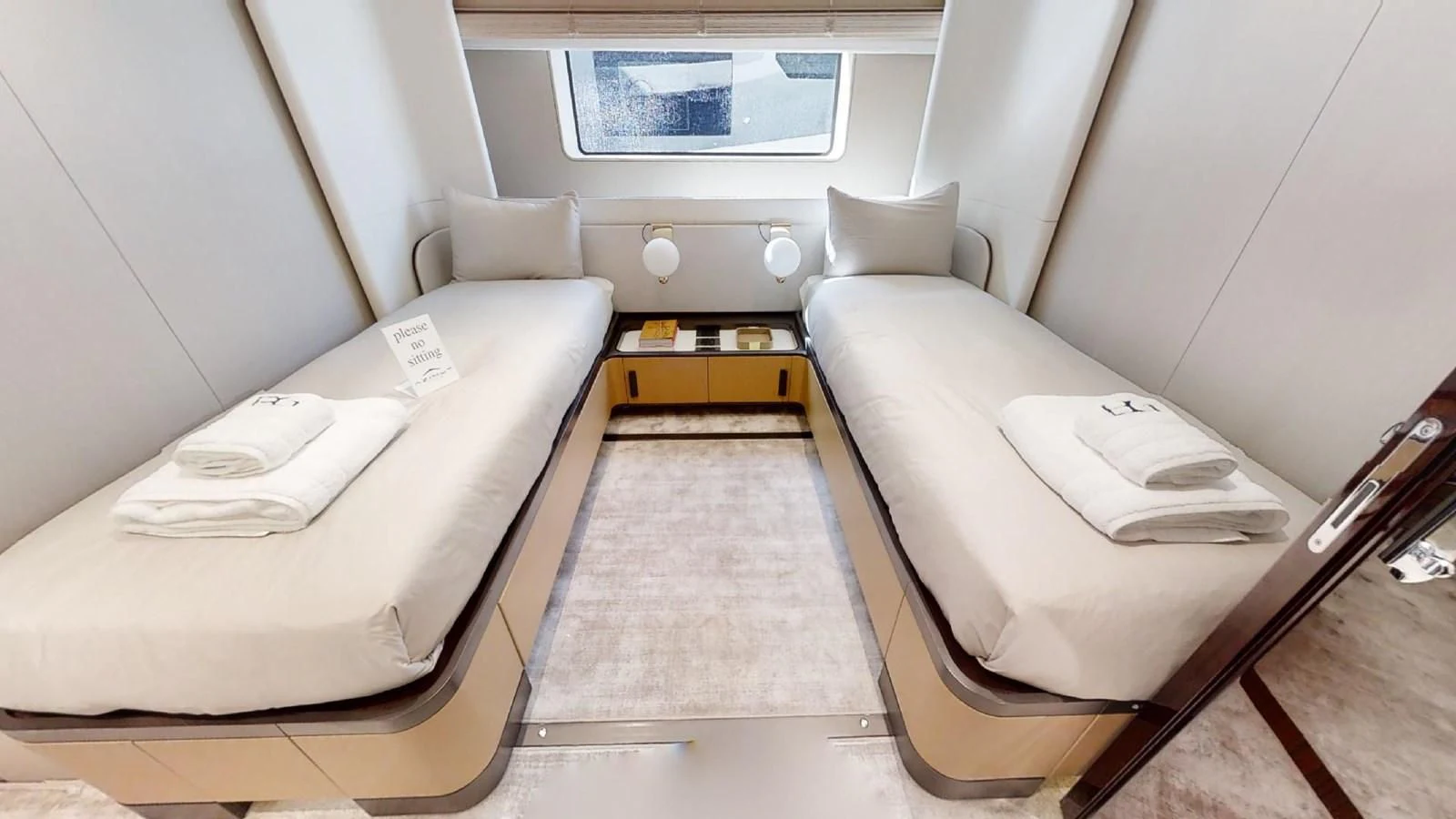 a room with a bed and a desk aboard VOLO MARE Yacht for Charter