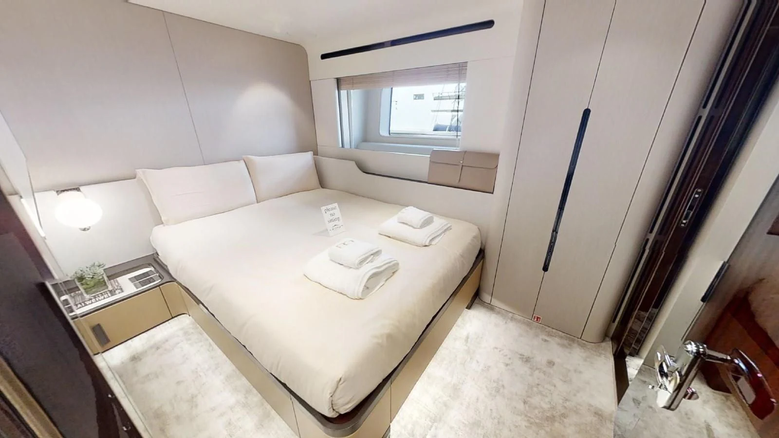 a room with a bed and a table aboard VOLO MARE Yacht for Charter