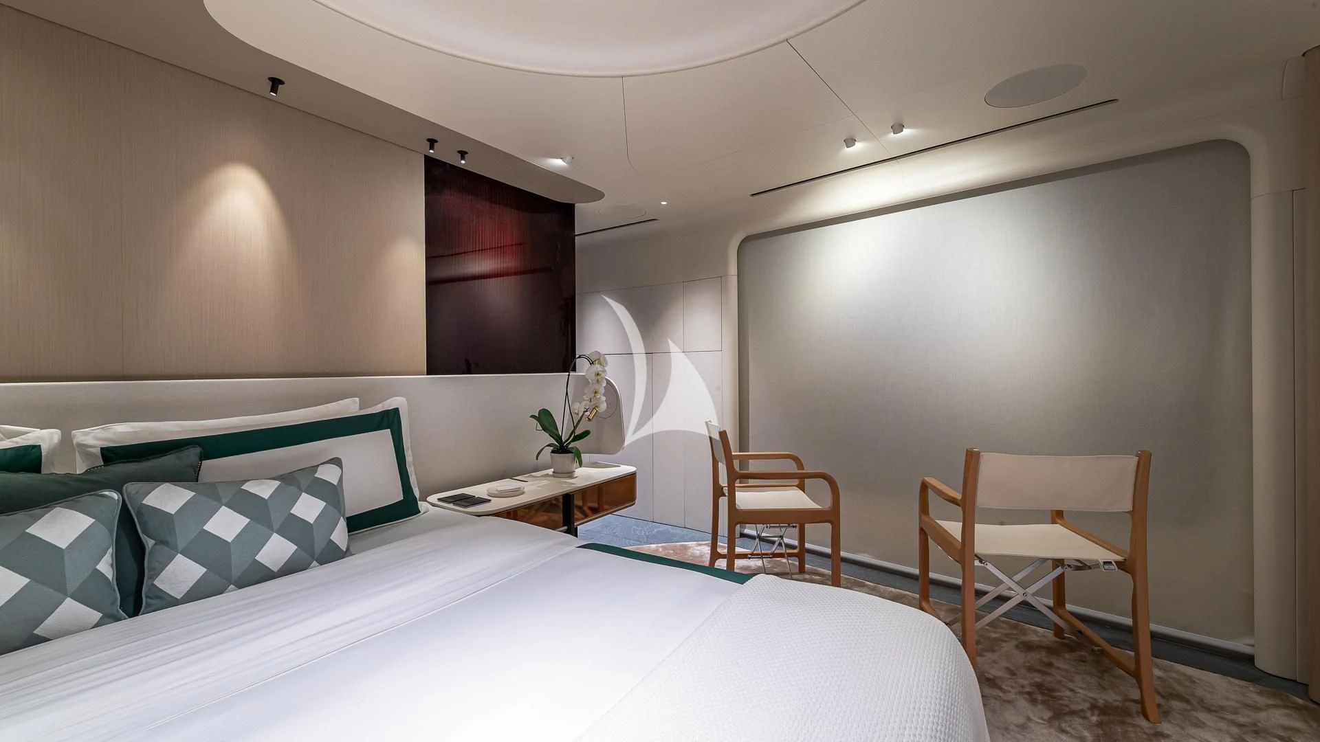 a room with a bed and a desk aboard VOLO MARE Yacht for Charter