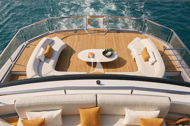 a boat with a table and chairs on the deck aboard VOLO MARE Yacht for Charter
