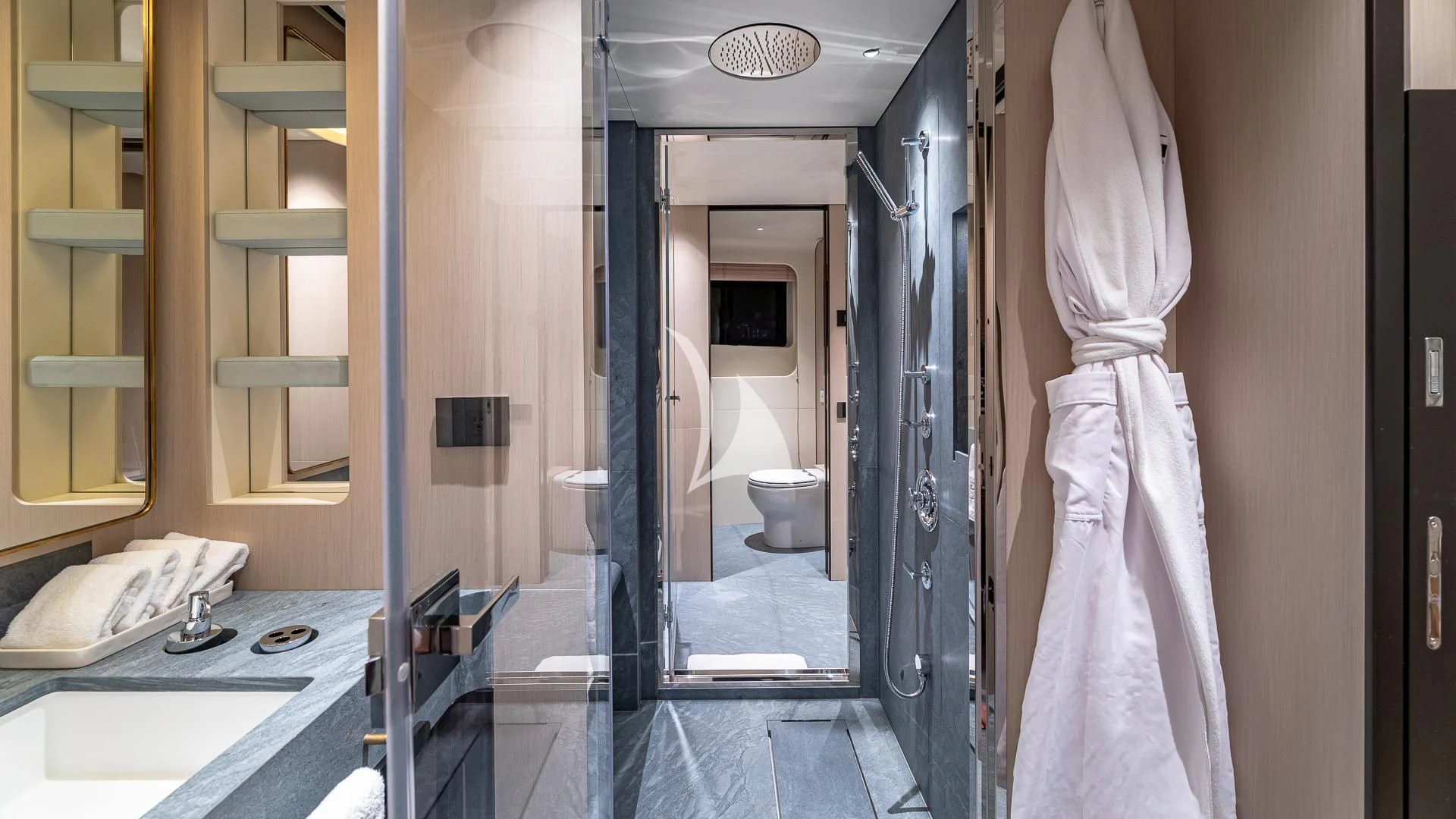 a bathroom with a robe on the wall aboard VOLO MARE Yacht for Charter