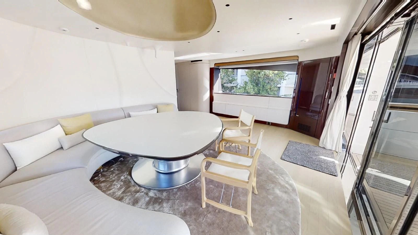 a room with a table and chairs aboard VOLO MARE Yacht for Charter