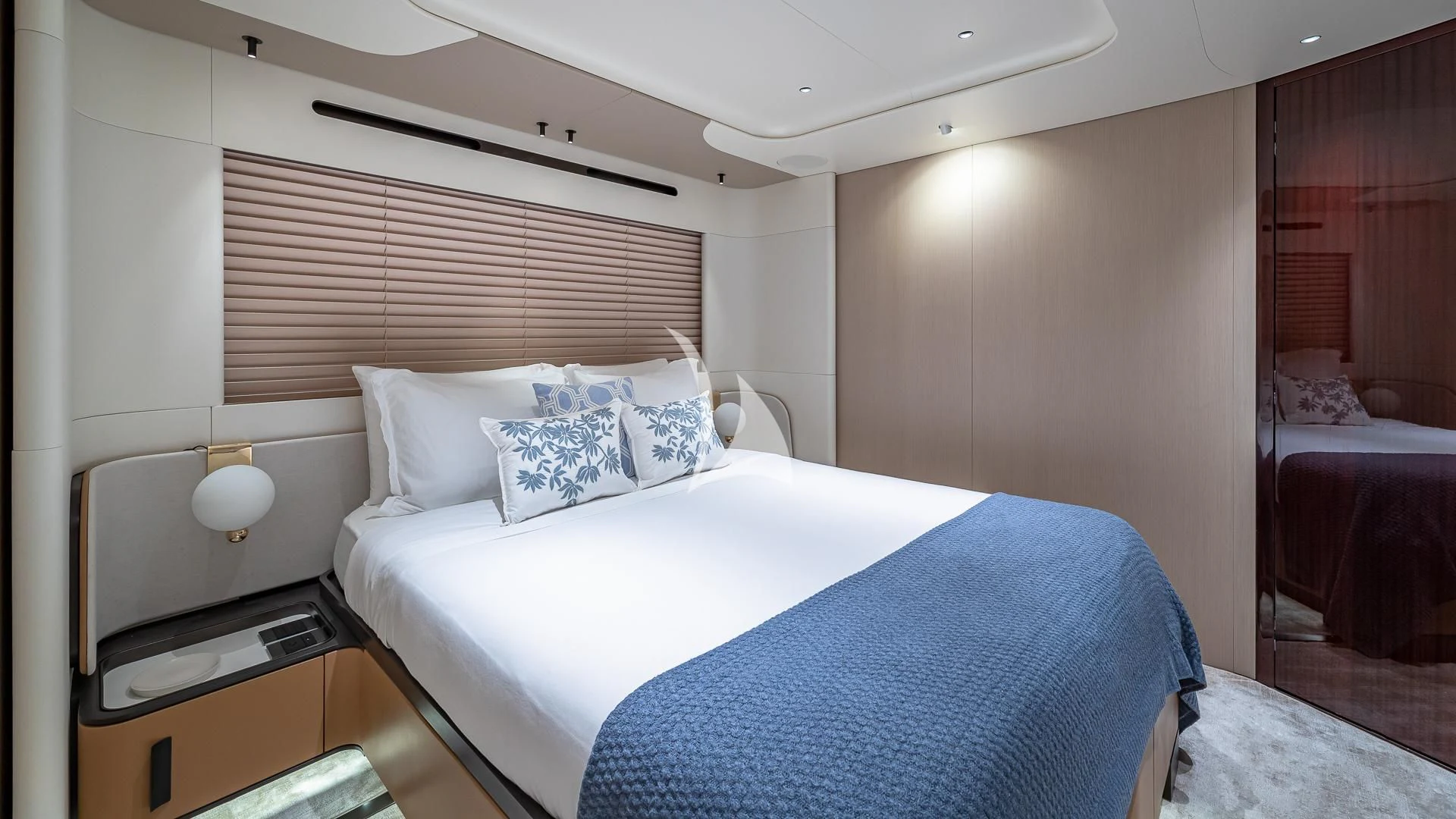 a room with a bed and a desk aboard VOLO MARE Yacht for Charter